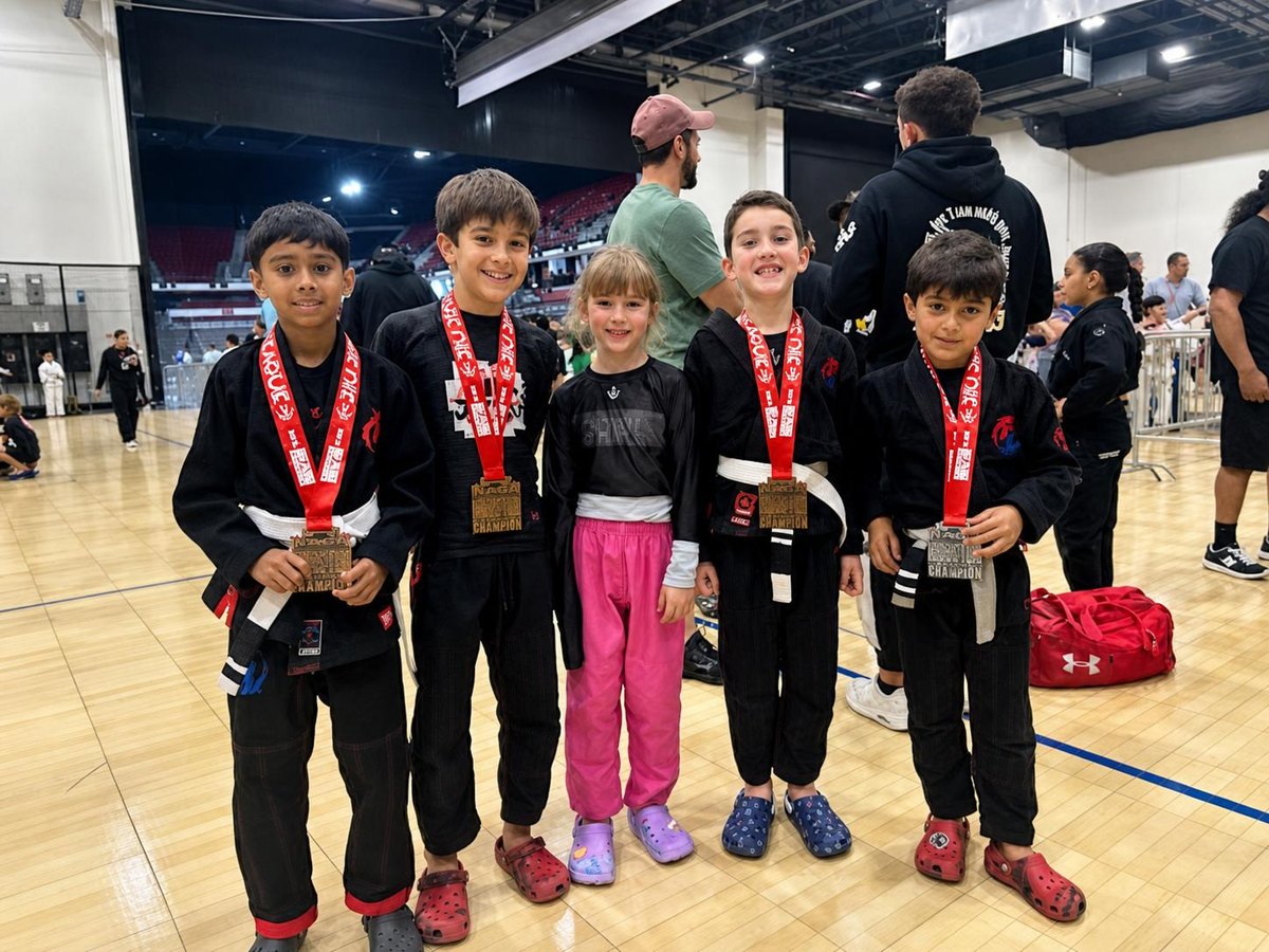 Team Legacy Martial Arts students with their competition medals